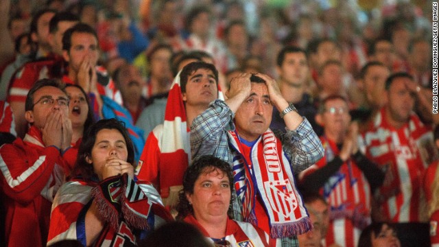  Atletico fans react during the match. 