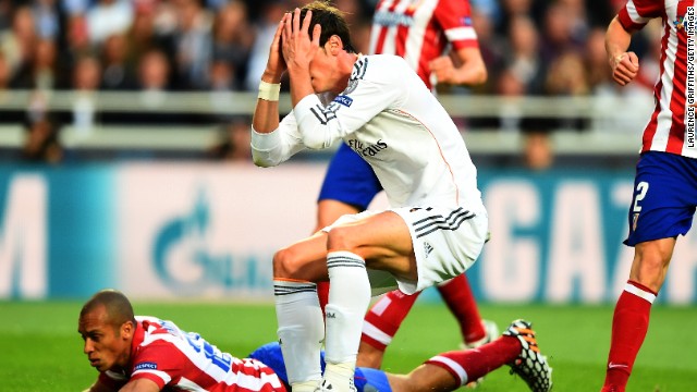 Bale holds his head in his hands in disbelief after wasting Real's best chance of the first half against Atletico.