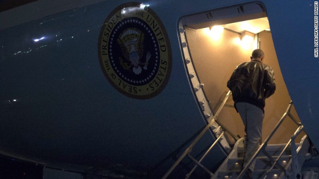 President Barack Obama boards Air Force One before departing Bagram Air Field. Obama landed Sunday, May 25, in Afghanistan for an unannounced trip to visit with U.S. forces on Memorial Day weekend. He thanked the troops for their service as the United States hands over responsibility to Afghan forces.