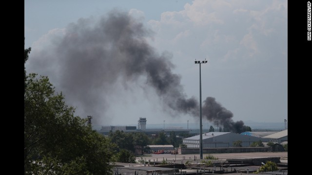 Smoke rises from the airport on May 26 after an airstrike by the Ukrainian military.
