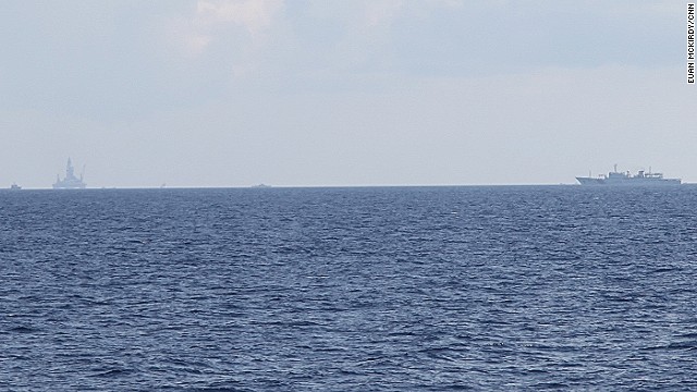 A Chinese Coast Guard ship screens a controversial oil platform drilling off the disputed Paracel Islands on May 28.
