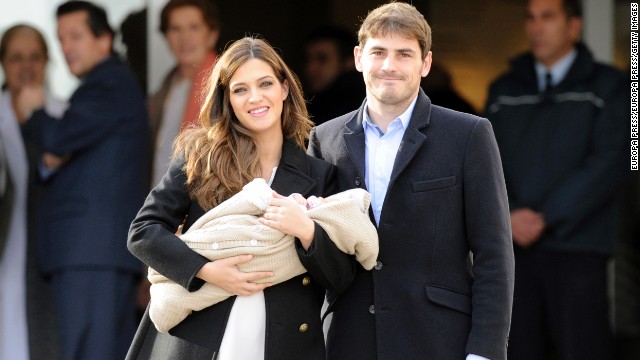 Spanish goalkeeper Iker Casillas isn't the only one carving a career on the field. Sports journalist Sara Carbonero, pictured here with their first child earlier this year, interviewed her thrilled boyfriend after winning the 2010 World Cup. So thrilled in fact, that he ended the interview by kissing her on live TV. 