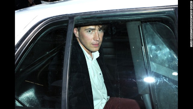 Vitalii Sediuk sits in the back of a police car after allegedly striking Brad Pitt in the face as Pitt and Angelina Jolie walked the red carpet at the premiere of Disney's "Maleficent" in Hollywood, California, on Wednesday, May 28. Sediuk has a history of confronting celebrities at red carpet events. 