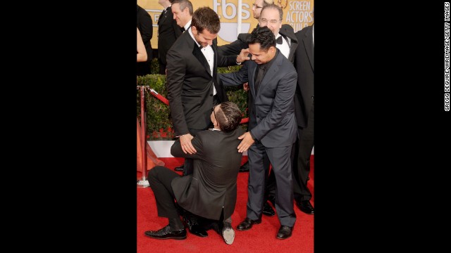 Sediuk hugs Bradley Cooper's legs as Michael Pena looks on at the 2014 Screen Actors Guild Awards in Los Angeles on January 18.