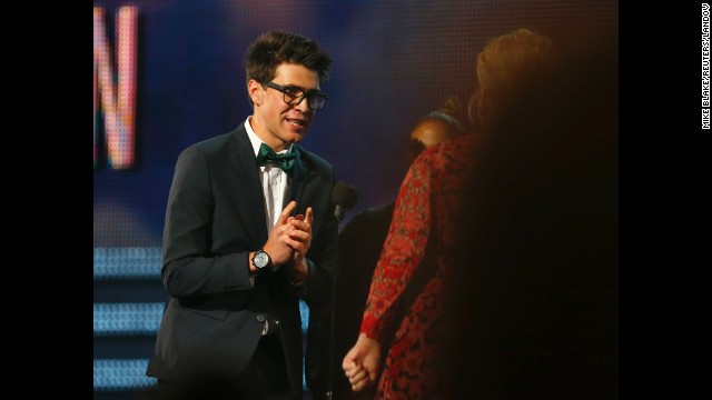 Sediuk runs on stage to greet singer Adele as she wins a Grammy for Best Pop Solo Performance at the 2013 Grammy Awards in Los Angeles. 