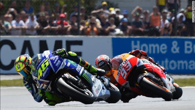 Introducing "The Doctor" of MotoGP -- Valentino Rossi briefly leads Marc Marquez at the French MotoGP on 18 May 2014.