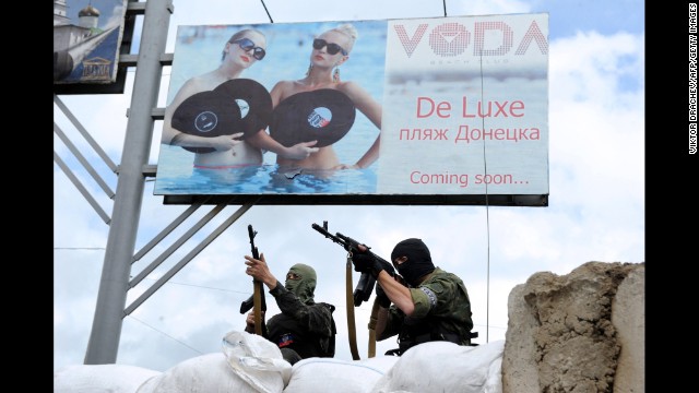 Pro-Russian militants stand guard at a barricade and checkpoint in Donetsk, Ukraine, on Sunday, June 1.