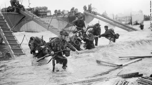 Commandos with the Royal Navy's 4th Special Service Brigade advance to Juno Beach at Saint-Aubin-sur-mer.