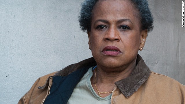 Miss Claudette Pelage (Michelle Hurst) is one of the oldest inmates at the prison. She ends up there after killing a client who abused an employee at her cleaning company. Other prisoners fear her. 