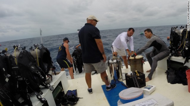 On the surface, FIU teams prepare pots with dry clothes, camera equipment and other gear to be sent down to Aquarius.
