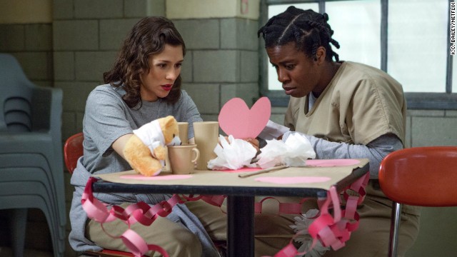 Lorna, left, with Suzanne "Crazy Eyes" Warren (Uzo Aduba), a disruptive inmate who takes a special liking to her "Dandelion," Chapman. Her more sensitive side is revealed later in season one.