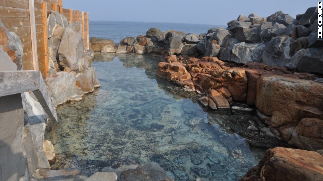 This side of the historic Sakinyu Onsen is for ladies only. The wall on the left keeps male bathers from seeing in, while the rock wall on the right is high enough to block outside views. That only leaves the open sea, where there's always the risk of a fisherman floating by. 