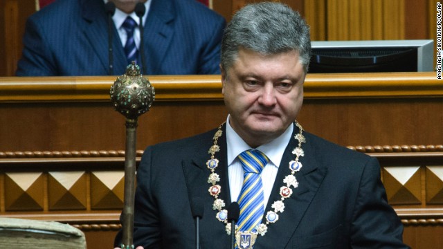 Poroshenko holds the bulava, the ceremonial mace of the President of Ukraine, during his inauguration ceremony Saturday, June 7, in Kiev, Ukraine. Poroshenko was elected three months after the ouster of former President Viktor Yanukovych.