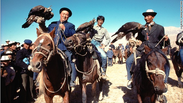 Wong How Man, center, in 1984 with Kirghiz eagle hunters at the border between China's Xinjiang province and the former Soviet Union. A year later, he led an expedition to find the source of the Yangtze River that required him and his team to travel nine days on horseback. 