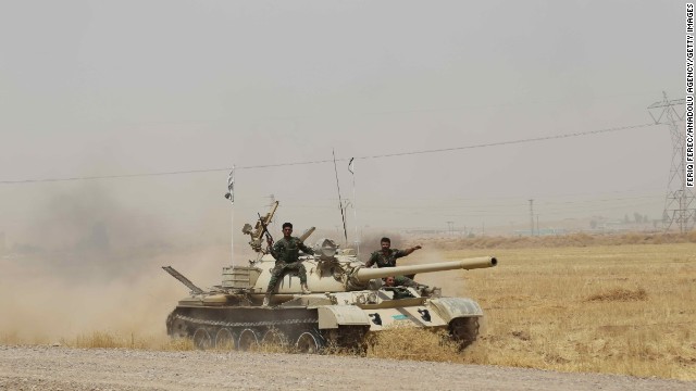 Kurdish Peshmerga forces, along with Iraqi special forces, deploy their troops and armored vehicles outside of Kirkuk, Iraq, on June 12.