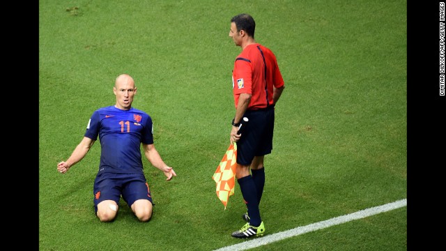 Robben slides on the ground after scoring his first goal. It gave the Dutch a 2-1 lead in the second half.
