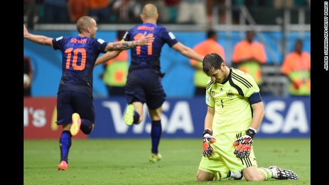 Spanish goalkeeper Iker Casillas, right, reacts after Dutch forward Arjen Robben, center, scored to put the finishing touches on a 5-1 win for the Netherlands on June 13. It was Robben's second goal of the match, which was played in Salvador, Brazil.
