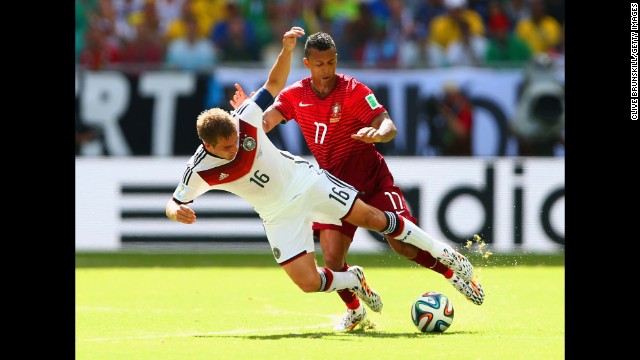 Germany's Philipp Lahm, left, competes for the ball with Portugal's Nani.