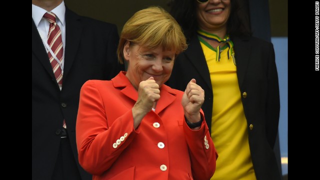 German Chancellor Angela Merkel watches the game in person.