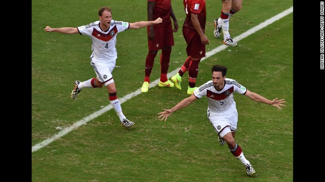 Mats Hummels, right, celebrates after heading in a corner kick to put Germany up 2-0.