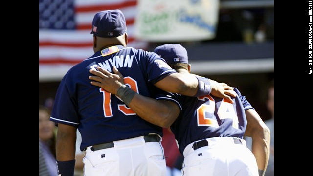 Gwynn celebrates his final game as he walks off the field with teammate Rickey Henderson in 2001.