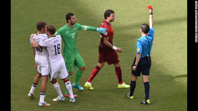 Portuguese defender Pepe, second right, receives a red card after clashing with Mueller in the first half.