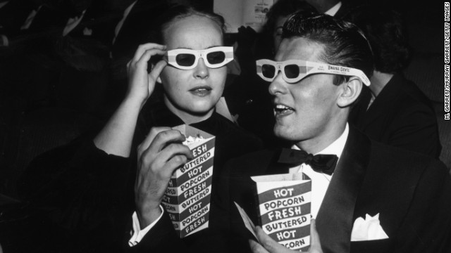 Actor Keefe Brasselle and his wife, Norma, wear 3-D glasses at the 1952 premiere of "Bwana Devil" in Hollywood, California. Discomfort associated with the glasses has been a problem throughout the history of 3-D entertainment, but the technology is finally going glasses-free.