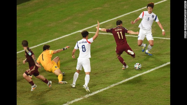 Russian forward Alexander Kerzhakov, second from right, scores the final goal of a 1-1 draw against South Korea on Tuesday, June 17, in Cuiaba, Brazil.