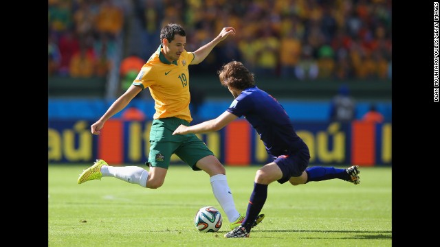 Ryan McGowan of Australia, left, takes on Daley Blind of the Netherlands. 