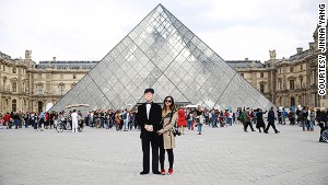 Timeless travelers: Jinna Yang with cutout of her father at the Louvre in Paris.