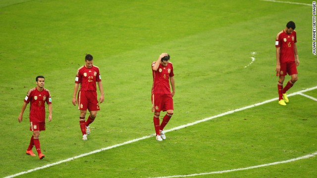 From left, Spanish players Pedro, Cesar Azpilicueta, Javi Martinez and Sergio Ramos react after Chile scored to take a 2-0 lead.