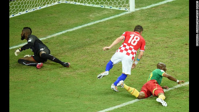 Croatian forward Ivica Olic, center, celebrates after scoring against the team's opening goal against Cameroon.