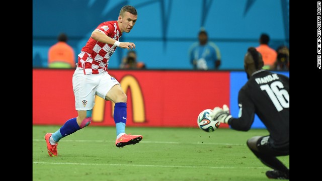 Croatian midfielder Ivan Perisic shoots past Itandje.
