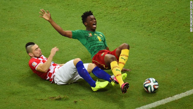 Danijel Pranjic of Croatia tackles Cameroon's Benjamin Moukandjo.