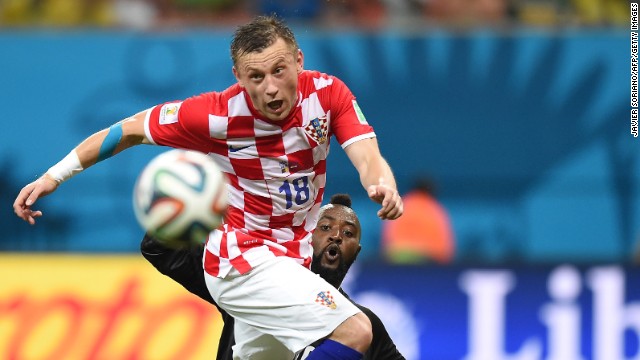 Cameroon's goalkeeper Charles Itandje, right, watches Croatia's Ivica Olic control the ball.