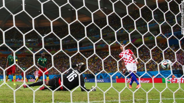 Mario Mandzukic of Croatia scores his second goal past Charles Itandje of Cameroon during a World Cup match Wednesday, June 18, in Manaus, Brazil. Croatia won 4-0, eliminating Cameroon from World Cup contention. 