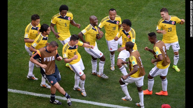 Colombia players dance after the first goal of the game, which was scored by James Rodriguez (No. 10) on a header.