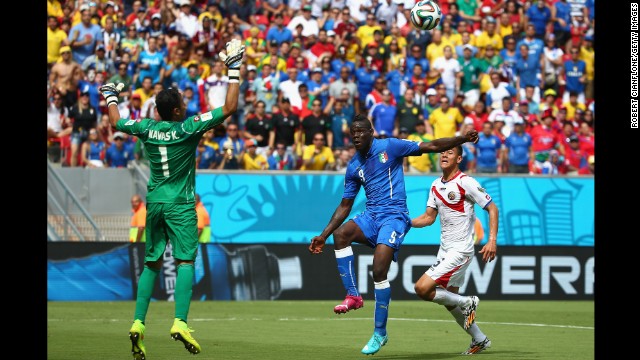 Balotelli, center, shoots wide past Costa Rican goalkeeper Keylor Navas.