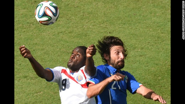 Costa Rica forward Joel Campbell, left, and Italy midfielder Andrea Pirlo vie for the ball.