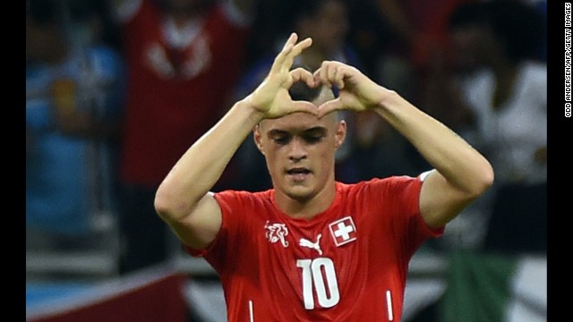 Swiss midfielder Granit Xhaka gestures after scoring his team's second goal late in the second half.