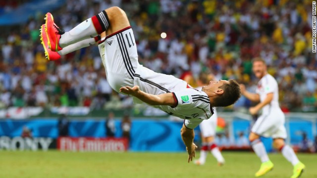 Germany substitute Miroslav Klose does a flip to celebrate after equaling the World Cup record of 15 goals overall, giving his team a 2-2 draw with Ghana on June 21 in Fortaleza, Brazil.