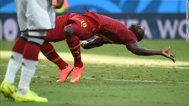 Ghana defender Jonathan Mensah falls.