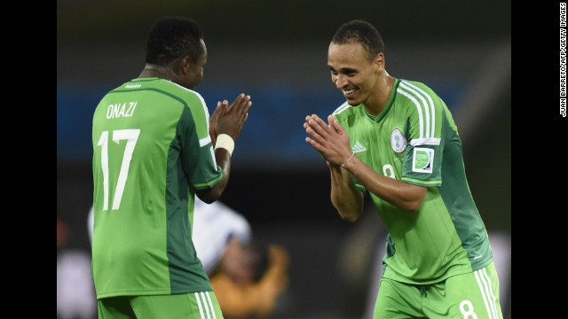 Nigeria midfielder Ogenyi Onazi, left, and forward Peter Odemwingie celebrate their win over Bosnia-Herzegovina in a World Cup match at Pantanal Arena in Cuiaba, Brazil, on Saturday, June 21. Nigeria won 1-0 and Bosnia was eliminated. 