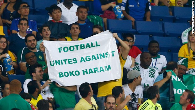  Fans hold up a sign during denouncing Boko Haram during the match. The militant group is blamed for scores of attacks in Nigeria.