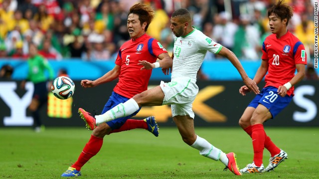 Islam Slimani of Algeria scores the first goal against South Korea.