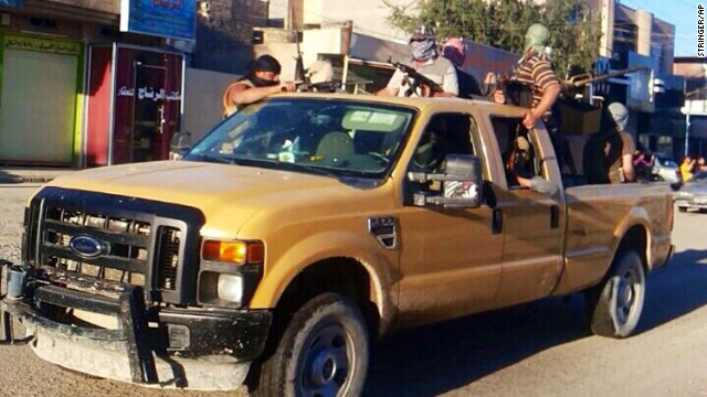 Members of ISIS patrol in Falluja on Saturday, June 21. 