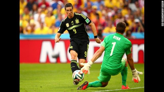 Spain's Fernando Torres scores his team's second goal past Australian Mathew Ryan.