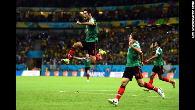 Rafael Marquez, left, of Mexico celebrates scoring his team's first goal with teammate Javier Hernandez.