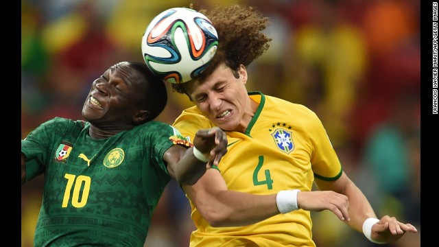 Brazilian defender David Luiz, right, vies with Cameroon forward Vincent Aboubakar.