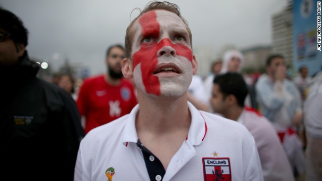 An England supporter in Rio de Janeiro watches a video broadcast as Uruguay scored its first goal against England on Thursday, June 19. Uruguay scored a late goal to win 2-1.